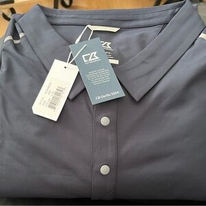 Cutter&Buck polo. Dark navy blue. Stripes on the shoulders.  Sun protection.